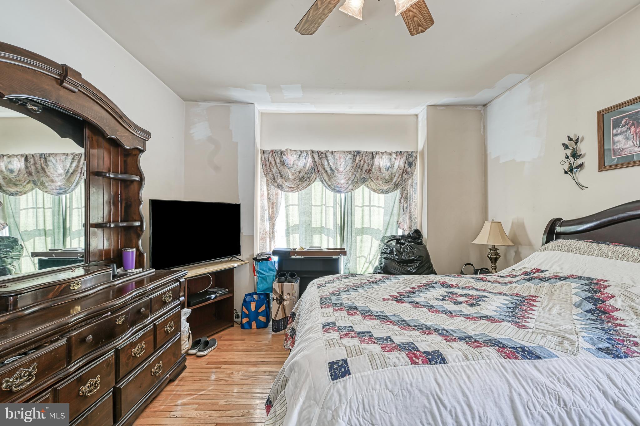 441 Hartwood Road Fredericksburg, VA 22406 - Photo 23 of 58 a bedroom with a bed and a flat screen tv