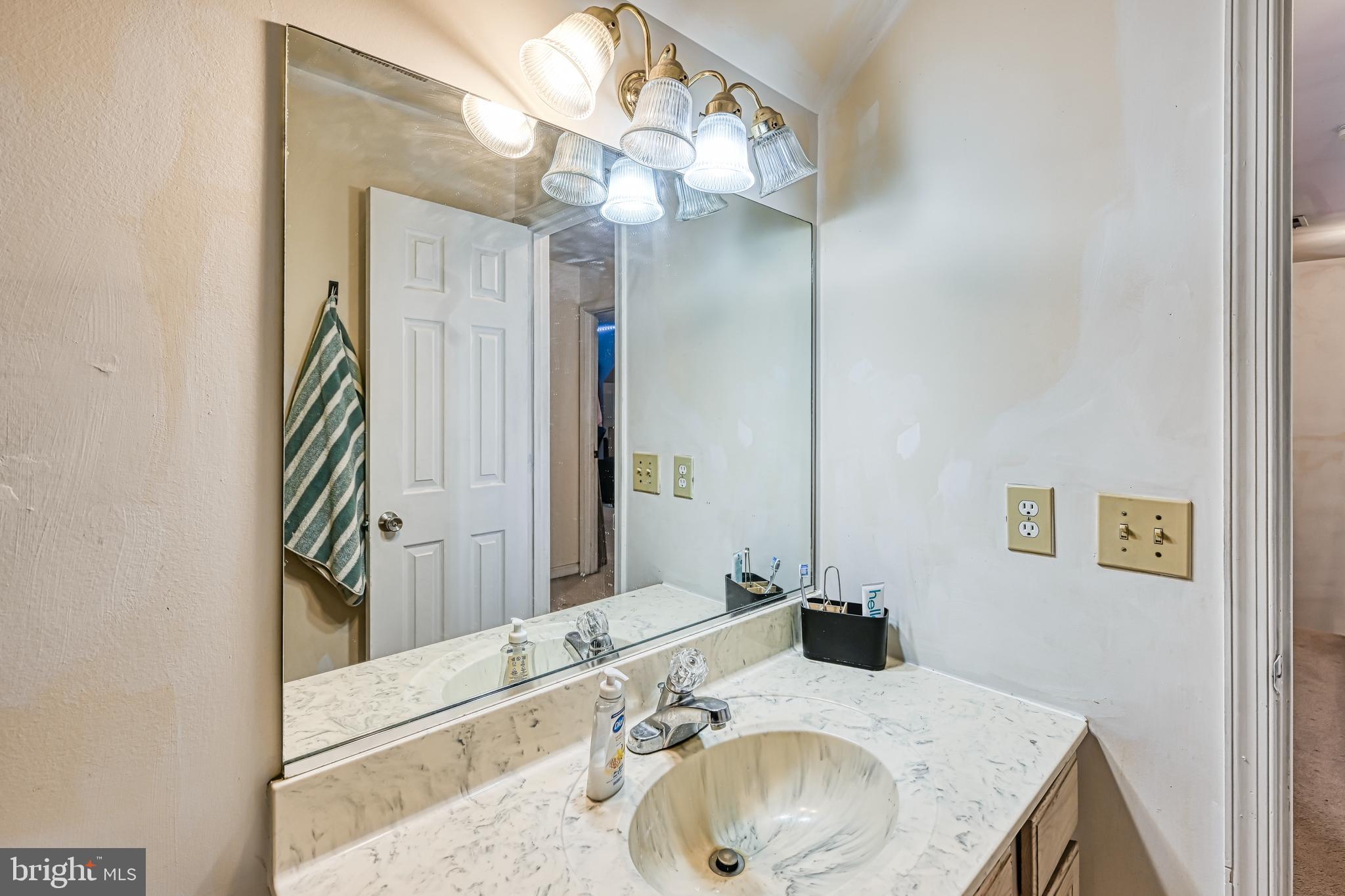 441 Hartwood Road Fredericksburg, VA 22406 - Photo 29 of 58 a bathroom with a sink and a mirror
