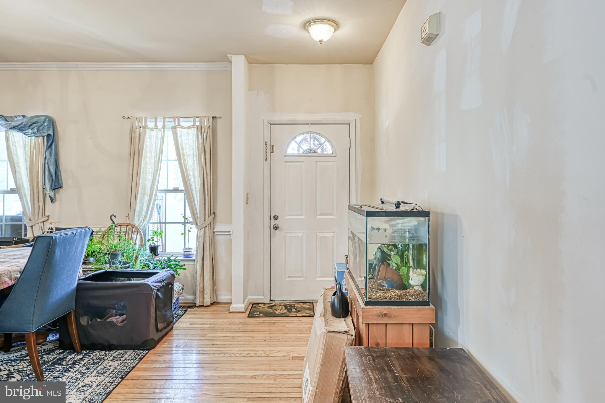 441 Hartwood Road Fredericksburg, VA 22406 - Photo 32 of 58 a view of a workspace with wooden floor and a potted plant