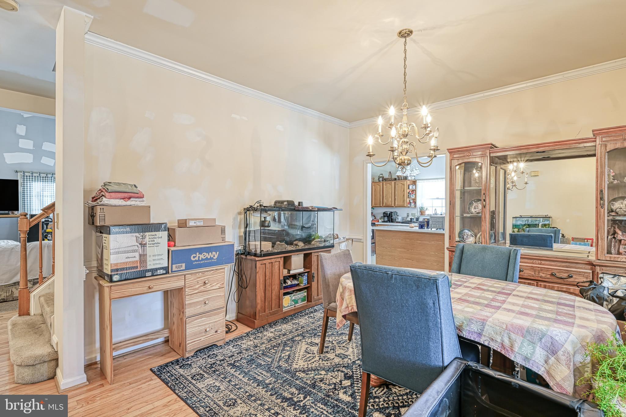 441 Hartwood Road Fredericksburg, VA 22406 - Photo 4 of 58 a dining room with furniture and a chandelier