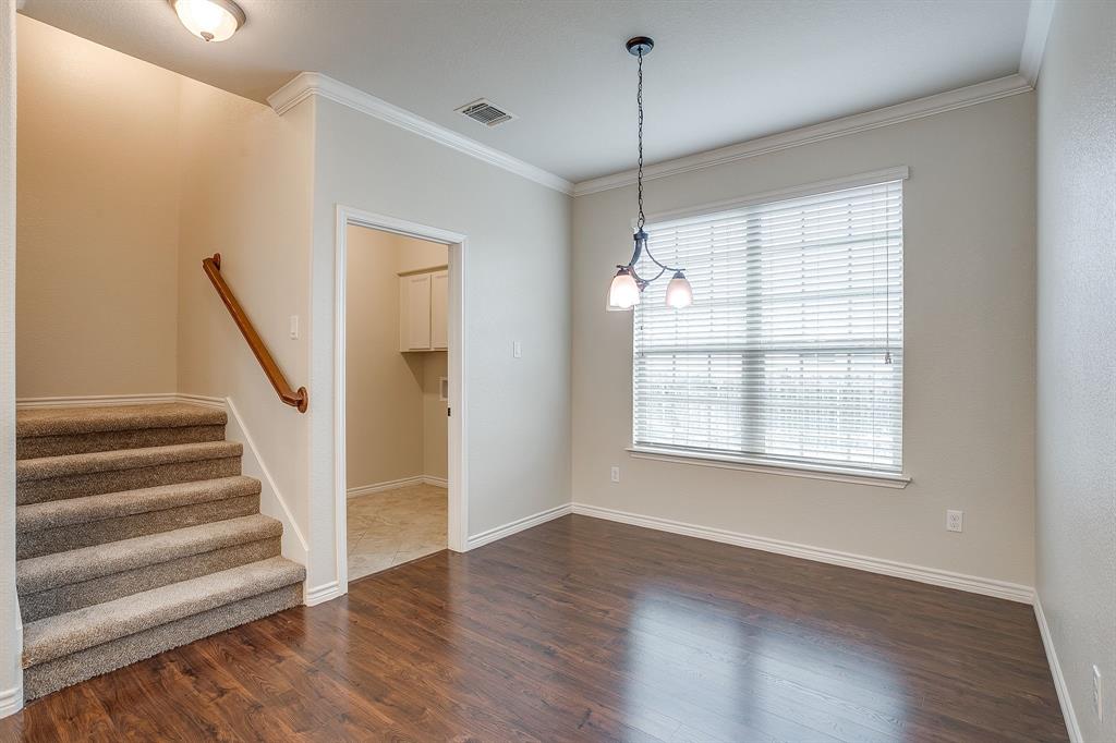 1225 Drummond Circle Waco, TX 76712 - Photo 13 of 40 a view of an empty room with wooden floor and a window
