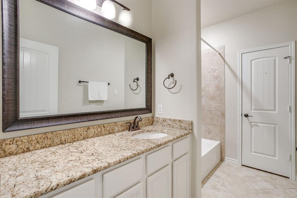 1225 Drummond Circle Waco, TX 76712 - Photo 33 of 40 a bathroom with a granite countertop sink and a mirror
