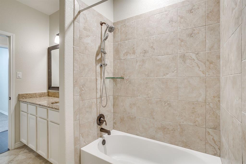 1225 Drummond Circle Waco, TX 76712 - Photo 34 of 40 a bathroom with a bathtub and shower