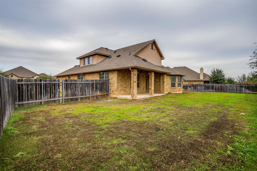 1225 Drummond Circle Waco, TX 76712 - Photo 36 of 40 a view of a house with a yard and porch
