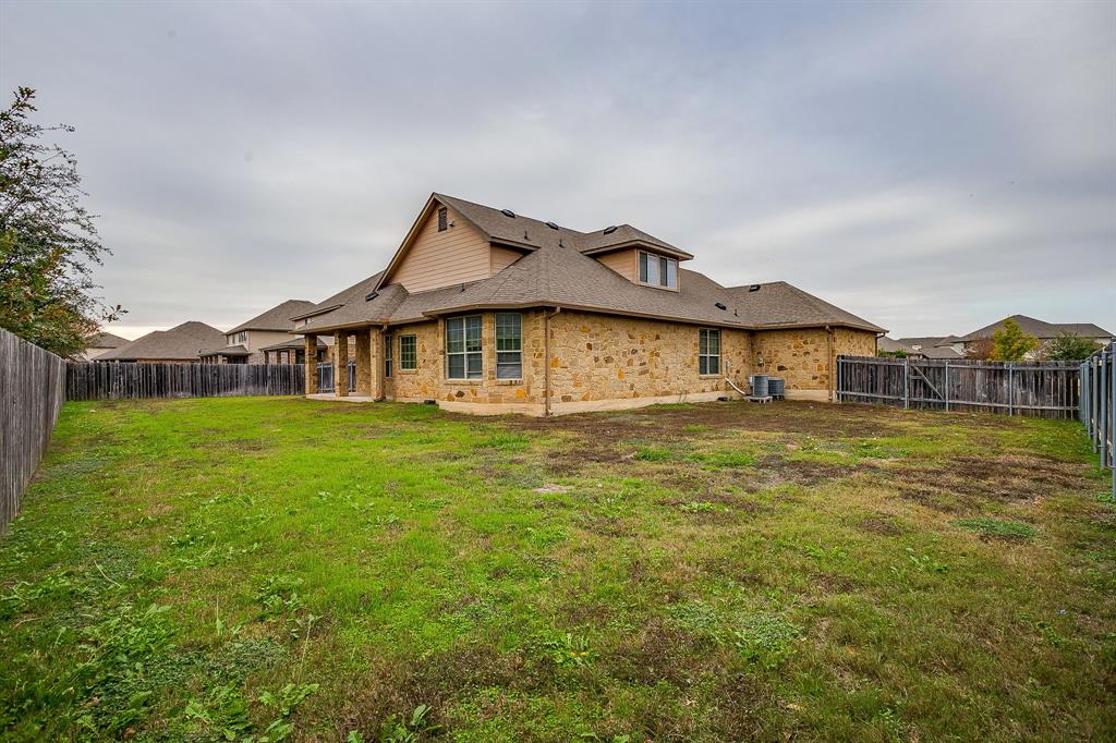 1225 Drummond Circle Waco, TX 76712 - Photo 37 of 40 a front view of a house with garden