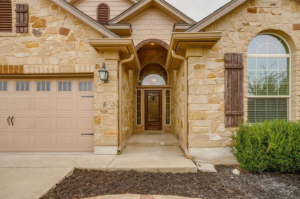 1225 Drummond Circle Waco, TX 76712 - Photo 4 of 40 a view of a brick house with large windows