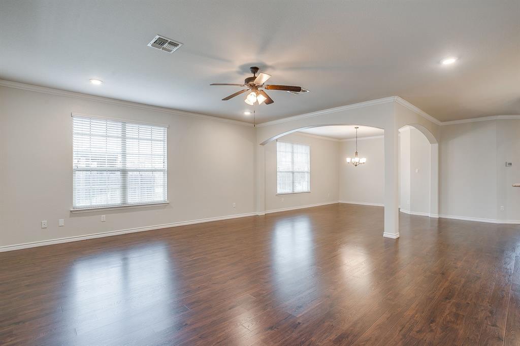 1225 Drummond Circle Waco, TX 76712 - Photo 8 of 40 a view of an empty room with wooden floor and a window