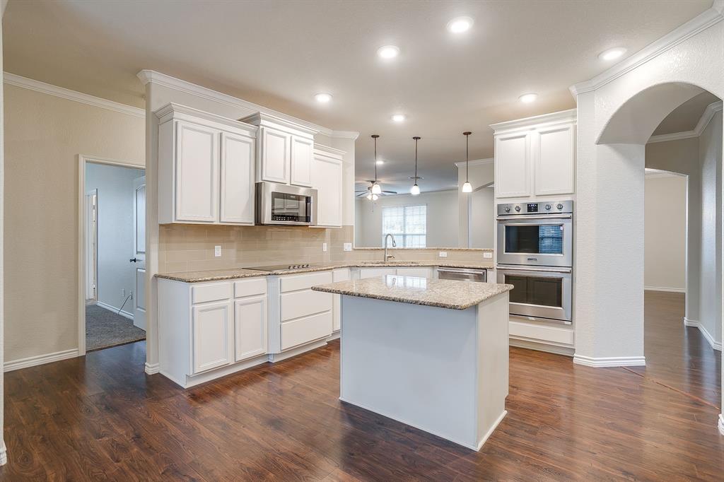 1225 Drummond Circle Waco, TX 76712 - Photo 9 of 40 a large kitchen with stainless steel appliances granite countertop a stove and a sink