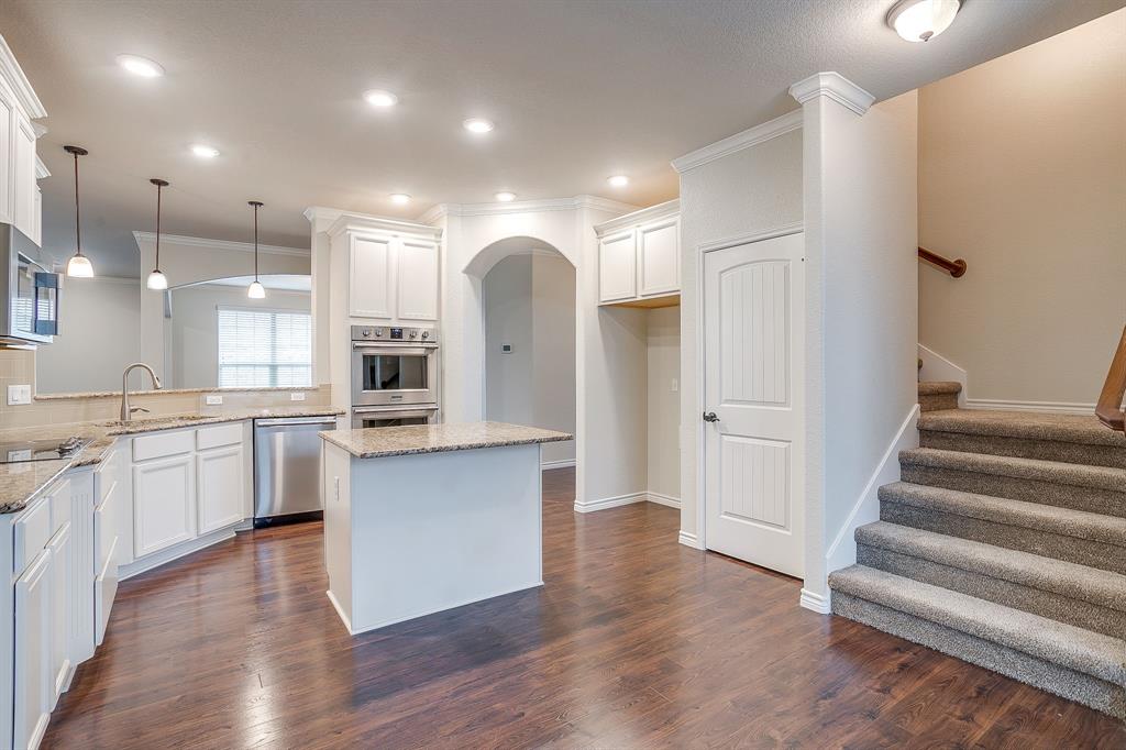 1225 Drummond Circle Waco, TX 76712 - Photo 10 of 40 a large kitchen with cabinets and wooden floor