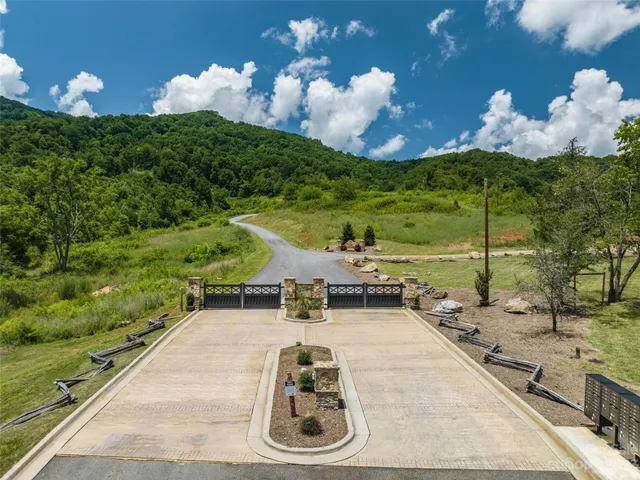 a view of a backyard with sitting area