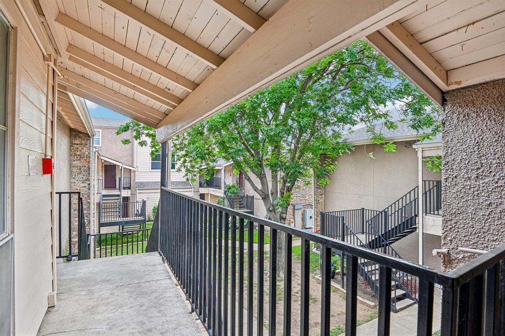 5534 Boca Raton Boulevard, Unit 292 Fort Worth, TX 76112 - Photo 2 of 31 a view of a porch with wooden floor and fence