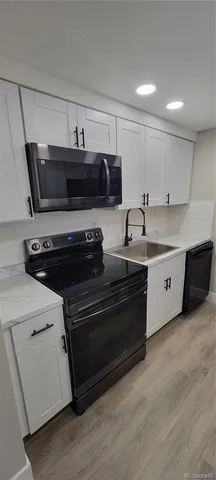 a kitchen with a stove and a microwave