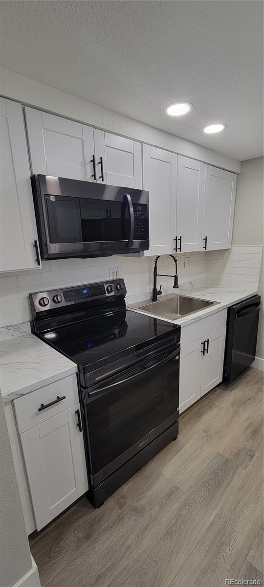 a kitchen with a stove and a microwave