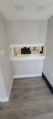 a view of kitchen with wooden floor