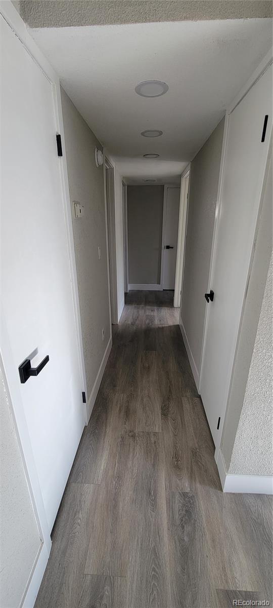 12140 Huron Street, Unit 101 Denver, CO 80234 - Photo 9 of 19 wooden floor in an empty room with a window