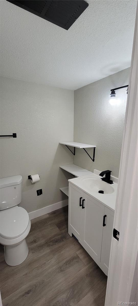 12140 Huron Street, Unit 101 Denver, CO 80234 - Photo 10 of 19 a spacious bathroom with a toilet and a sink