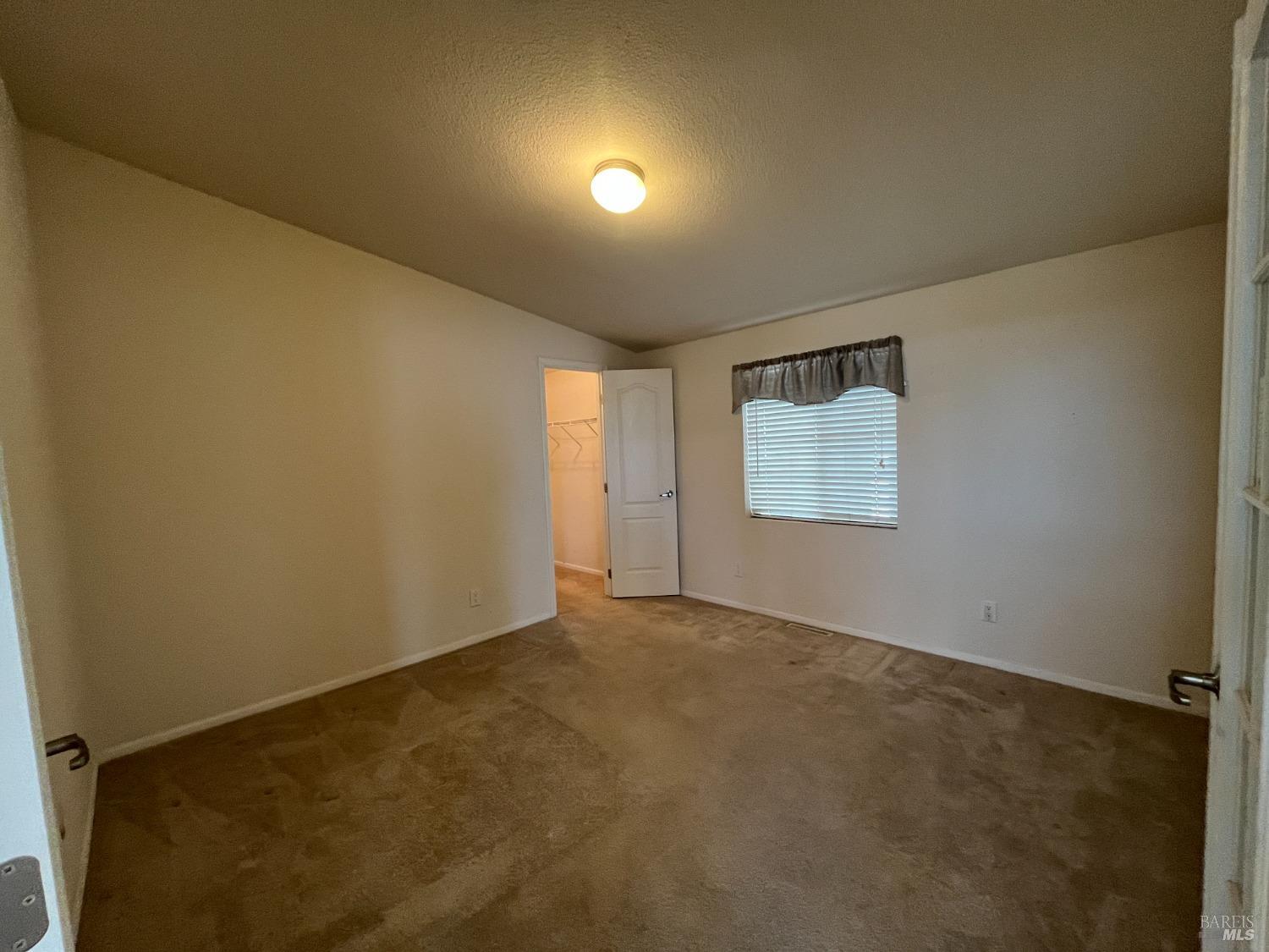 54 Norfolk Drive Santa Rosa, CA 95401 - Photo 11 of 57 an empty room with windows