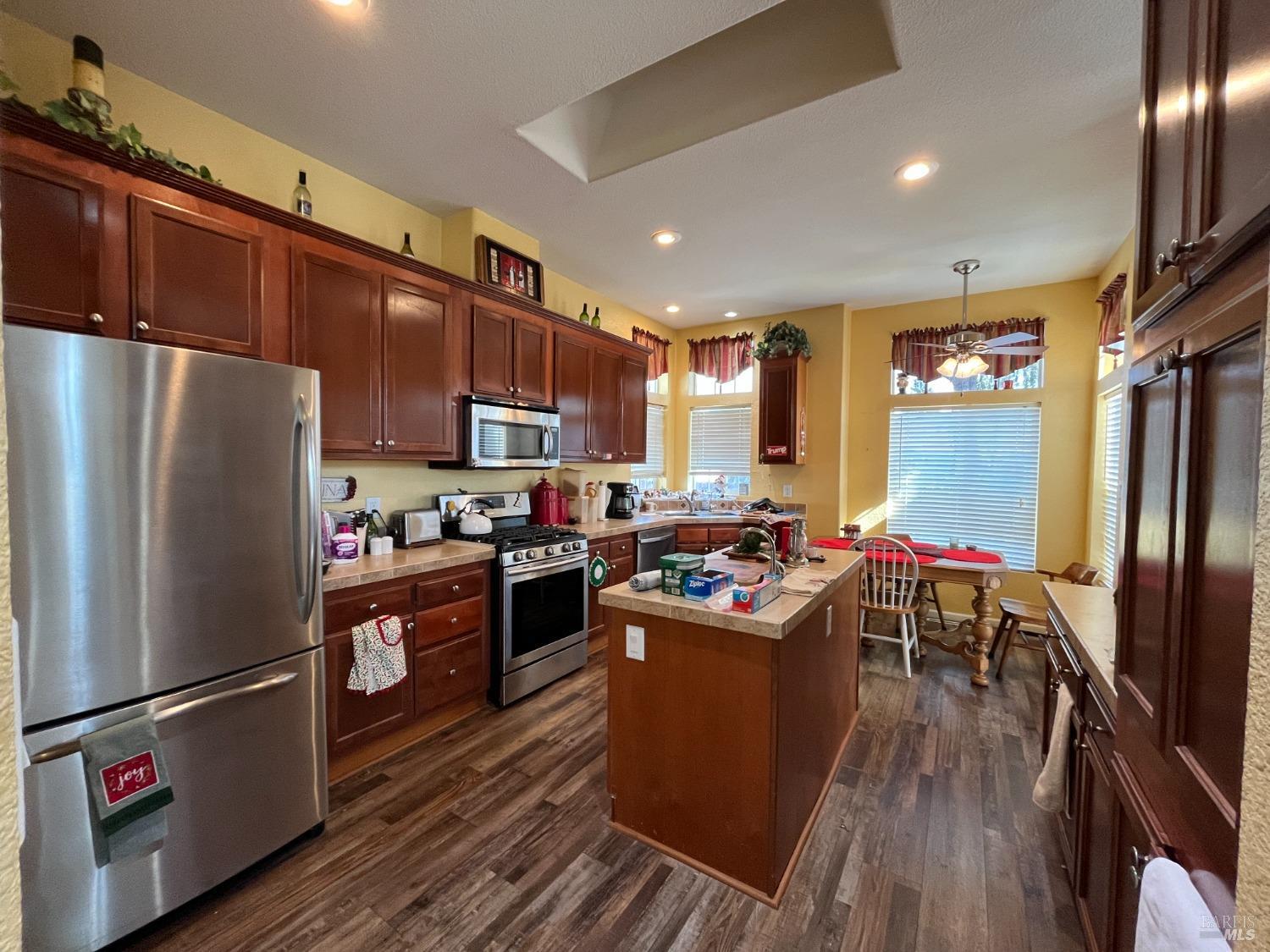 54 Norfolk Drive Santa Rosa, CA 95401 - Photo 24 of 57 a kitchen with stainless steel appliances granite countertop a refrigerator stove microwave and sink