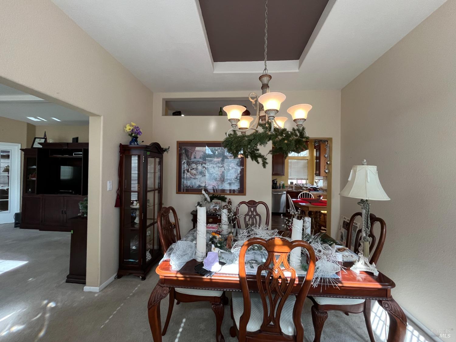 54 Norfolk Drive Santa Rosa, CA 95401 - Photo 27 of 57 a view of a dining room with furniture and chandelier