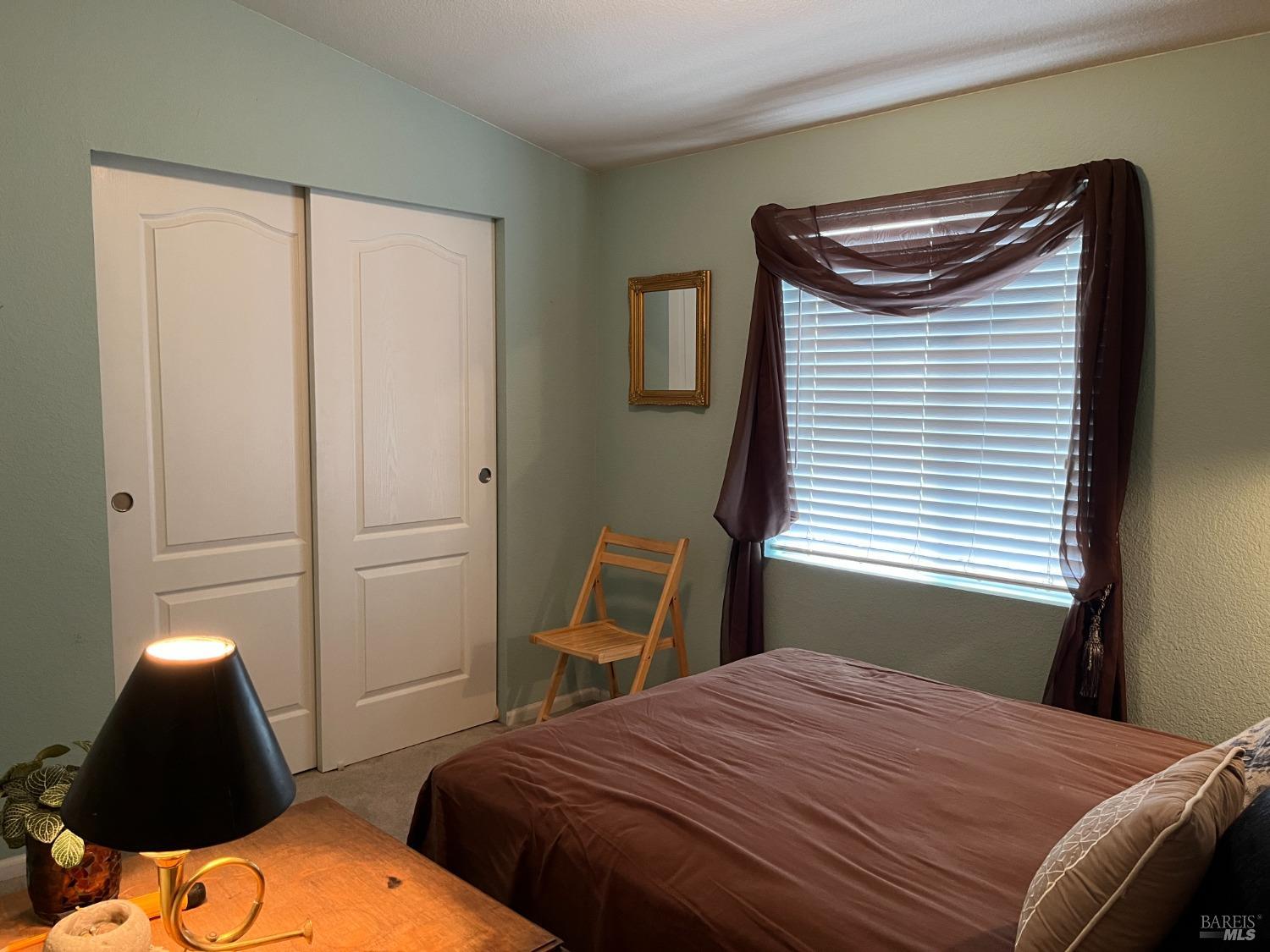 54 Norfolk Drive Santa Rosa, CA 95401 - Photo 34 of 57 a bedroom with a bed and a window