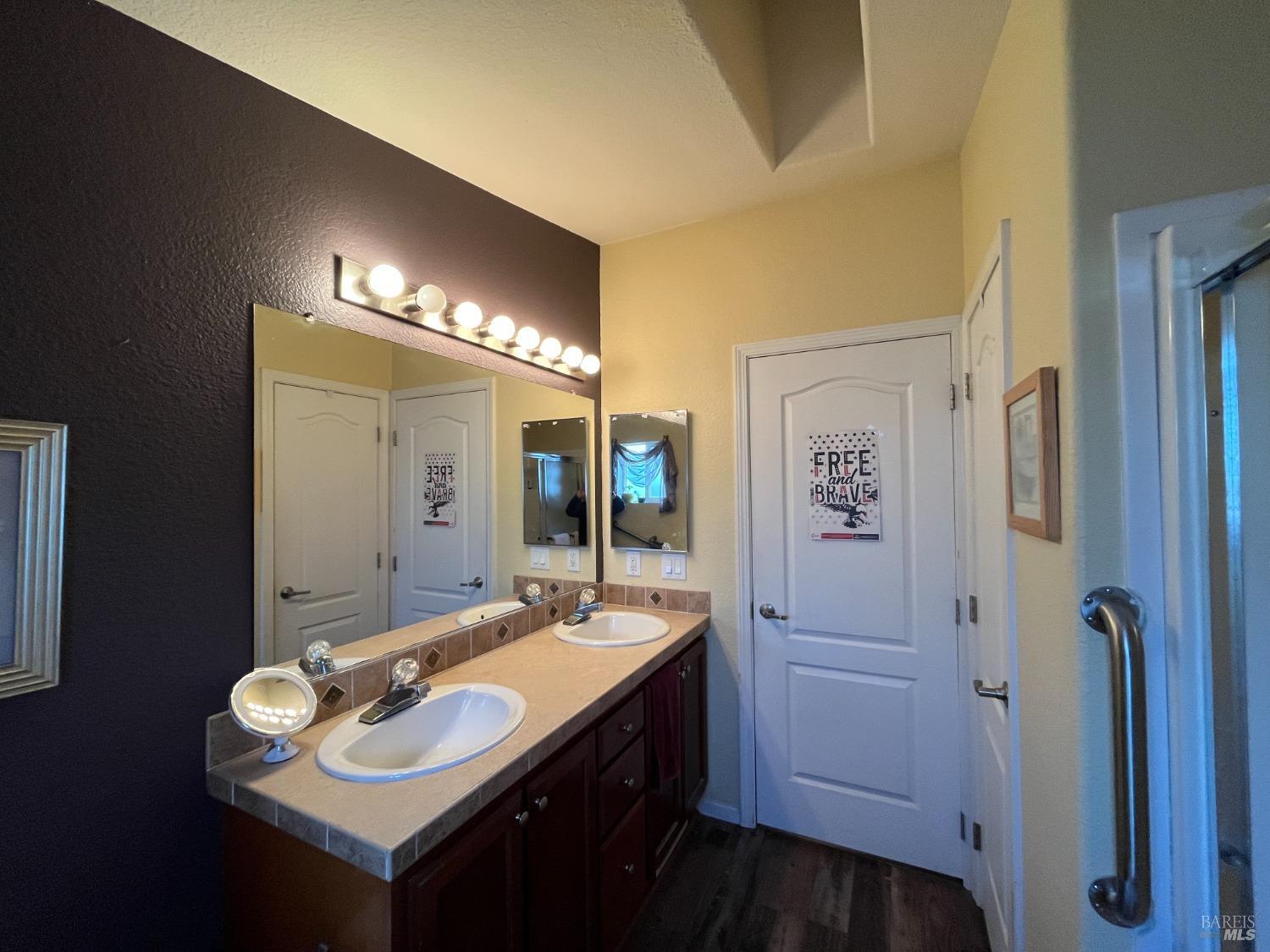 54 Norfolk Drive Santa Rosa, CA 95401 - Photo 39 of 57 a bathroom with a sink and a mirror