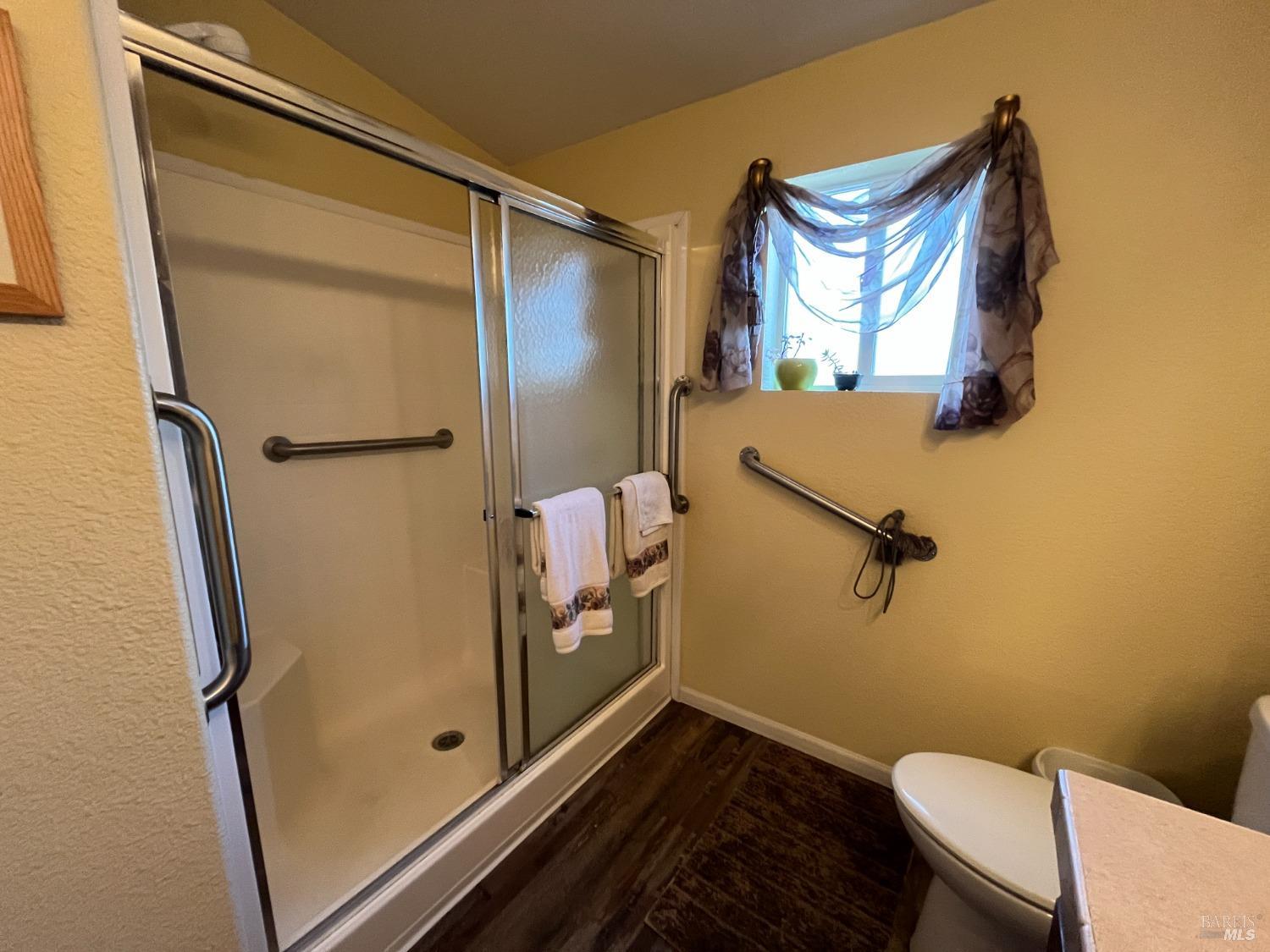 54 Norfolk Drive Santa Rosa, CA 95401 - Photo 40 of 57 a bathroom with a toilet sink and mirror