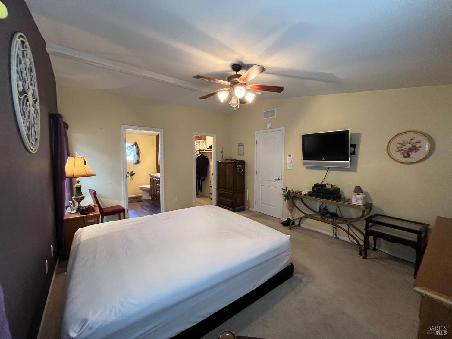 54 Norfolk Drive Santa Rosa, CA 95401 - Photo 45 of 57 a bedroom with a bed and a chandelier