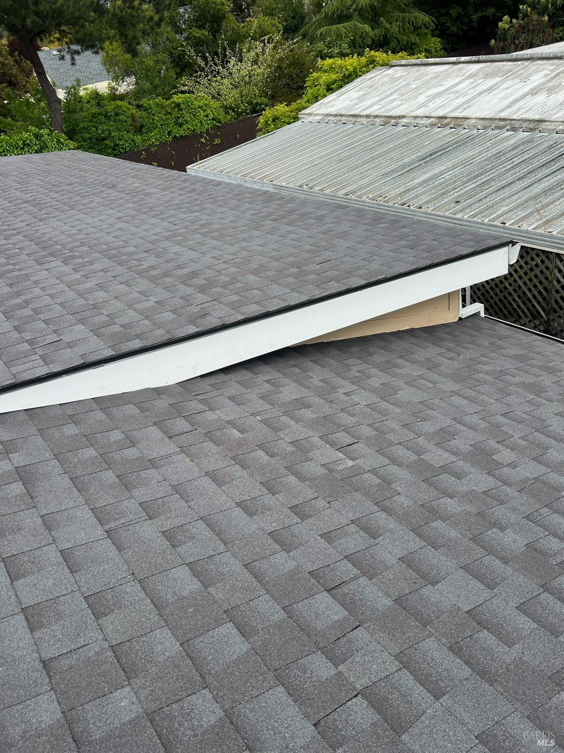 54 Norfolk Drive Santa Rosa, CA 95401 - Photo 56 of 57 a wooden bench sitting in the middle of a yard