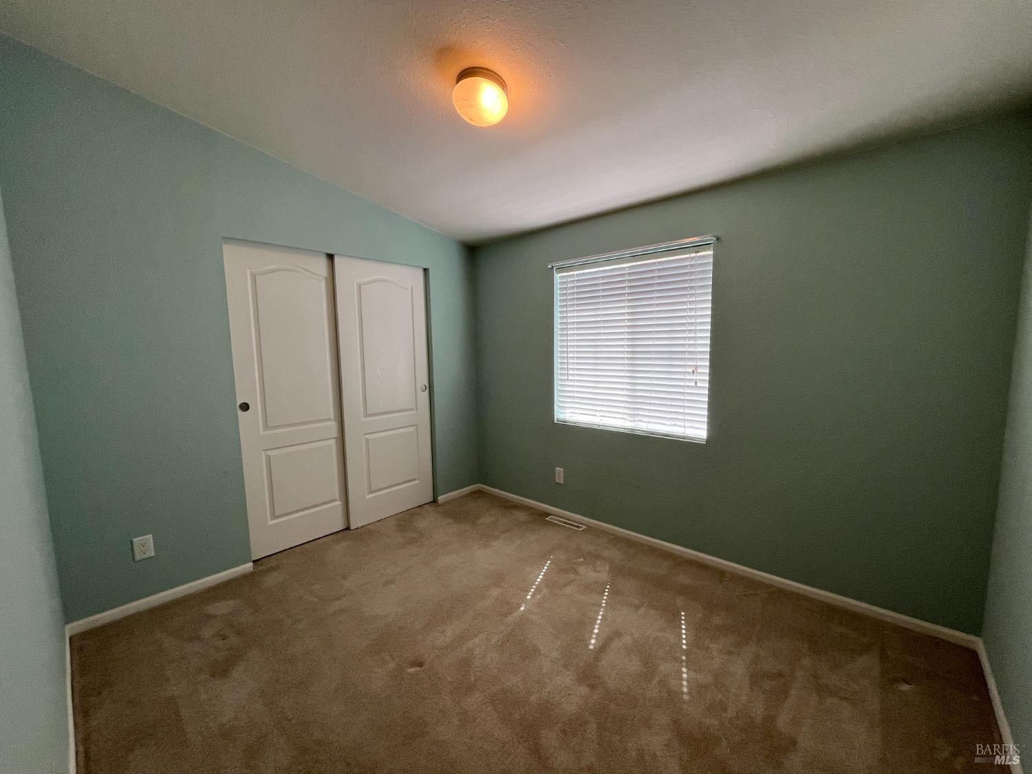 54 Norfolk Drive Santa Rosa, CA 95401 - Photo 9 of 57 an empty room with windows
