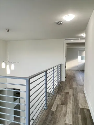a view of a balcony with chairs