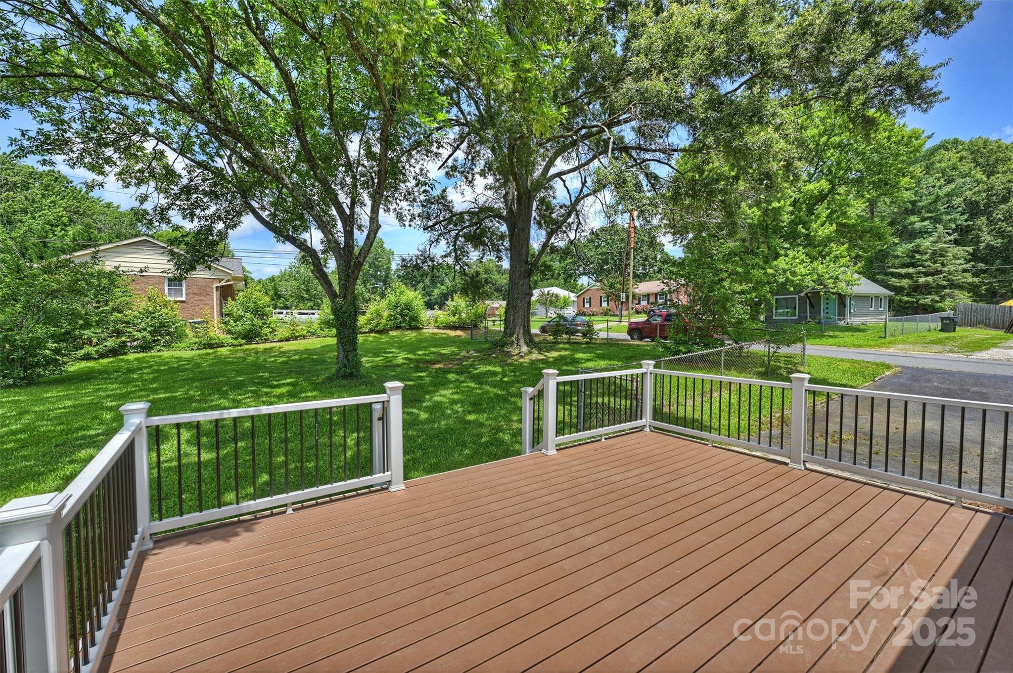 3729 Woodleaf Road Charlotte, NC 28205 - Photo 18 of 23 a view of a deck with a yard