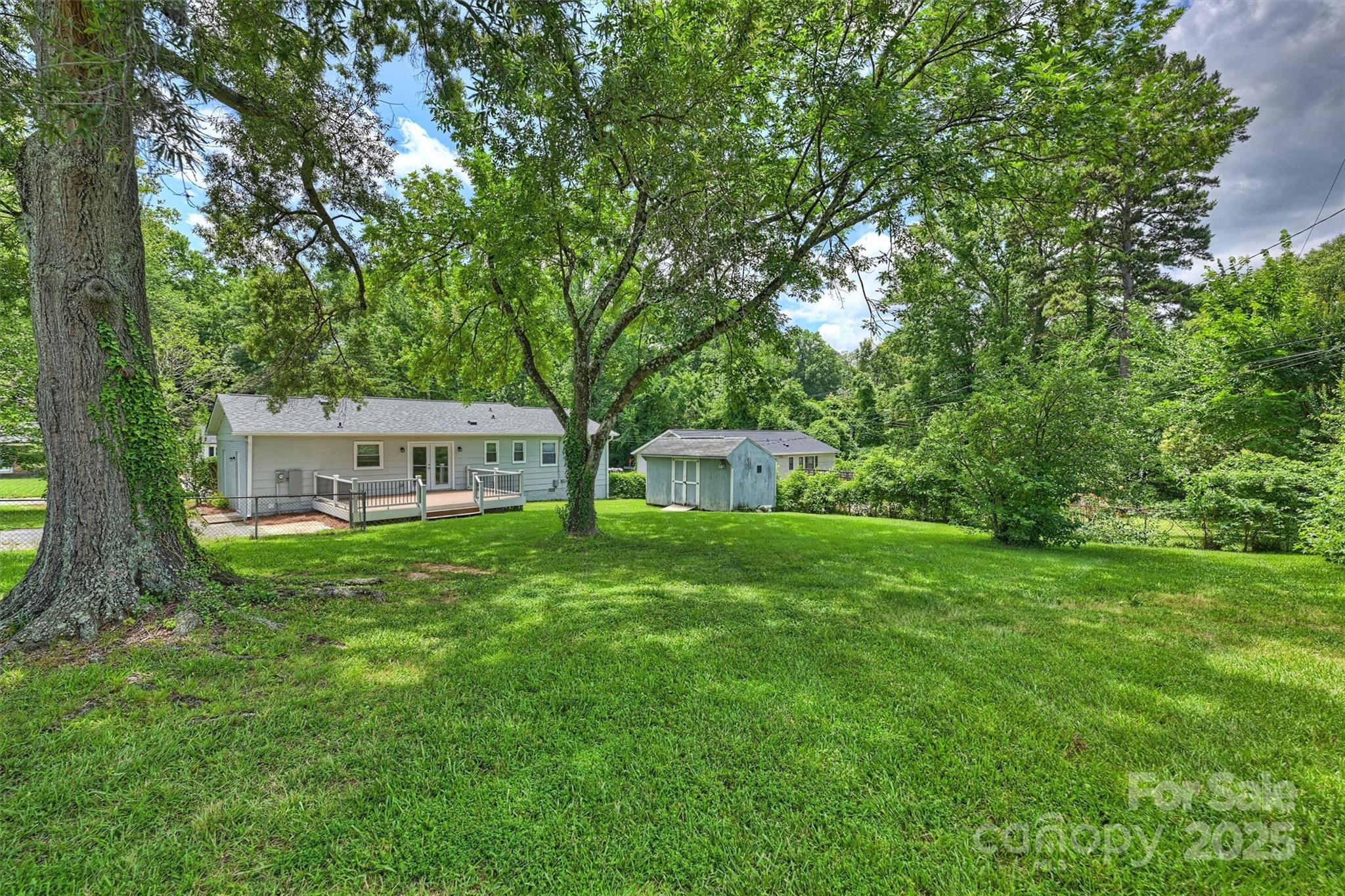 3729 Woodleaf Road Charlotte, NC 28205 - Photo 20 of 23 a front view of a house with a garden