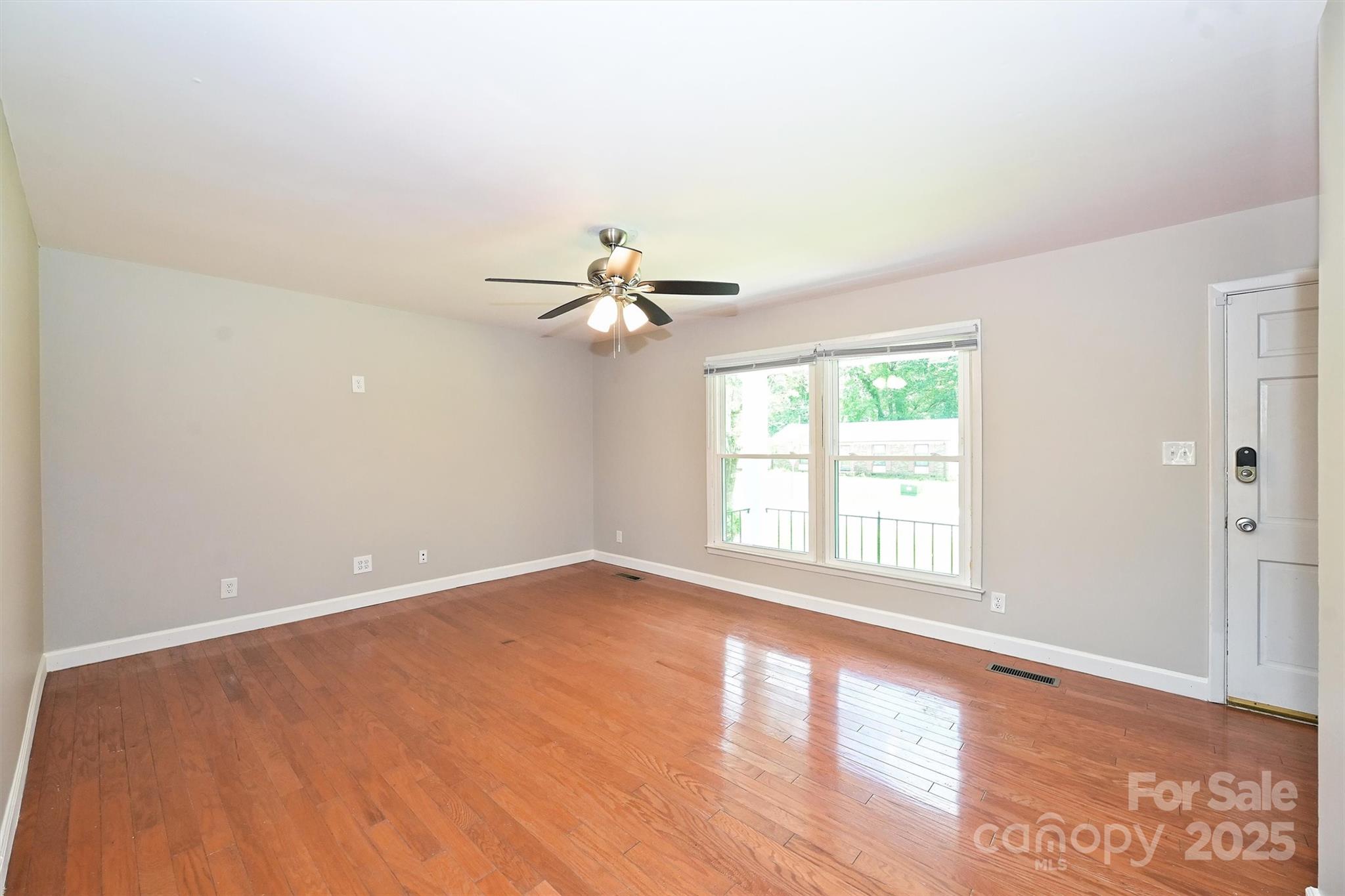 3729 Woodleaf Road Charlotte, NC 28205 - Photo 2 of 23 a view of an empty room with a window