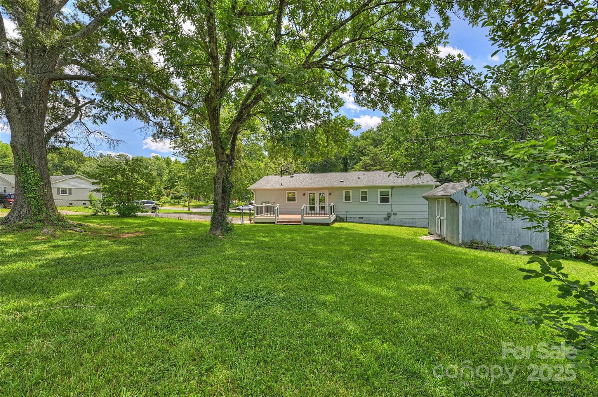 3729 Woodleaf Road Charlotte, NC 28205 - Photo 22 of 23 a view of a house with backyard and garden