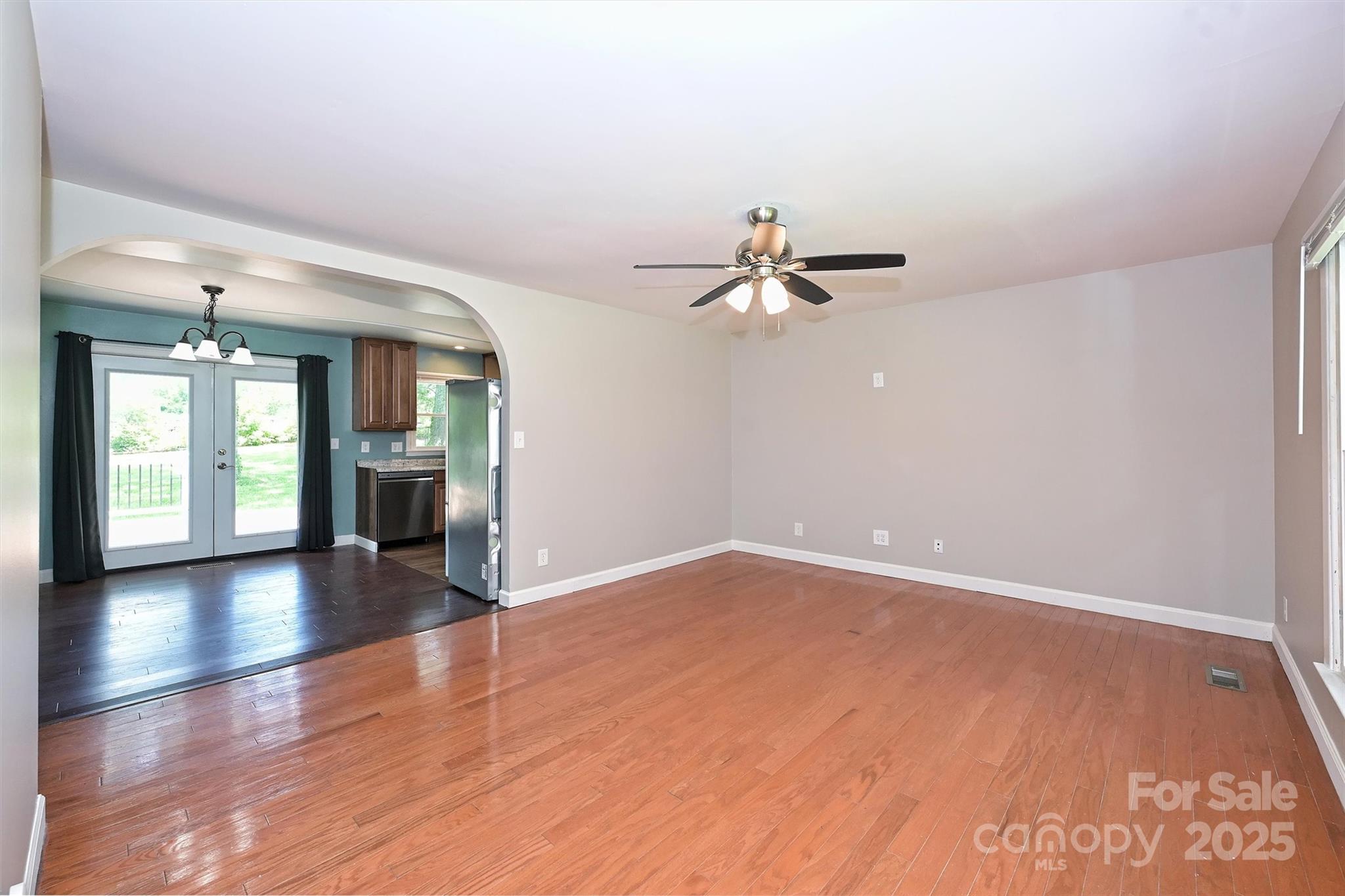 3729 Woodleaf Road Charlotte, NC 28205 - Photo 3 of 23 wooden floor in an empty room with a window