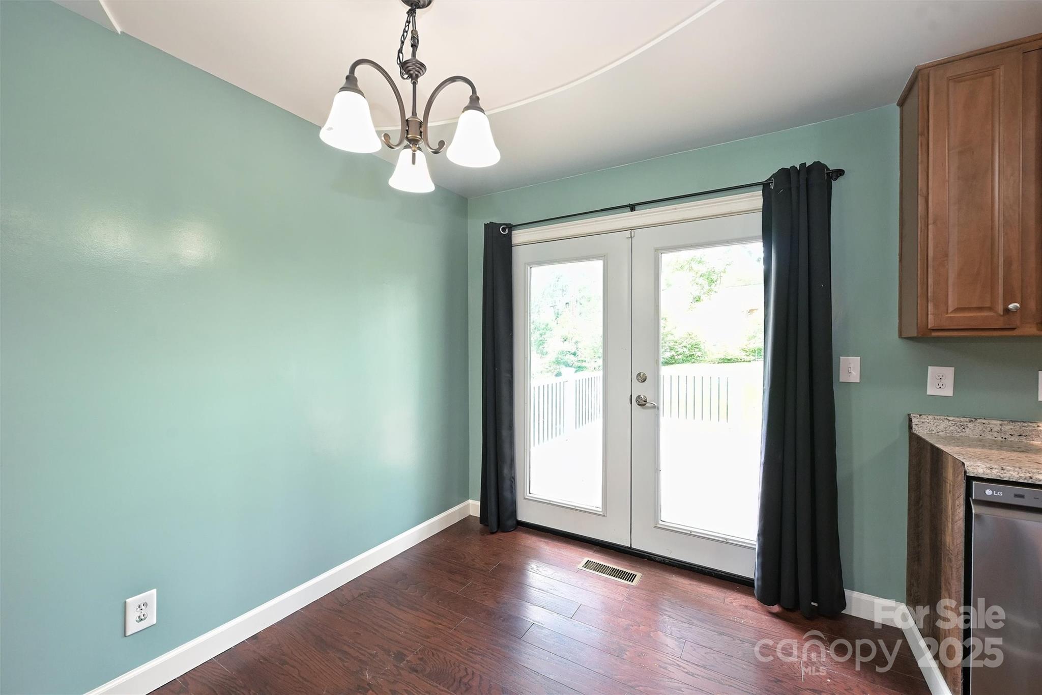 3729 Woodleaf Road Charlotte, NC 28205 - Photo 10 of 23 a view of a livingroom with wooden floor