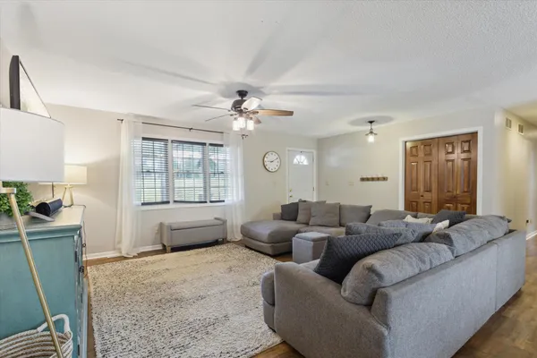 a living room with furniture and a large window