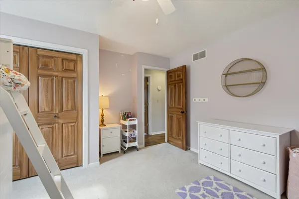 a view of a room with cabinet and mirror