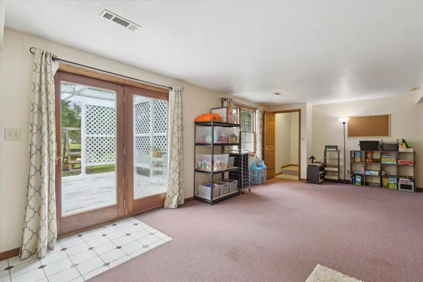 a view of a room with toys and a large window