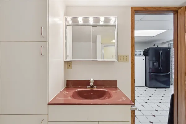 a bathroom with a sink and a mirror