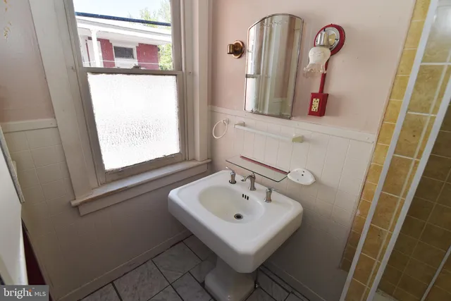 a bathroom with a sink a mirror and vanity