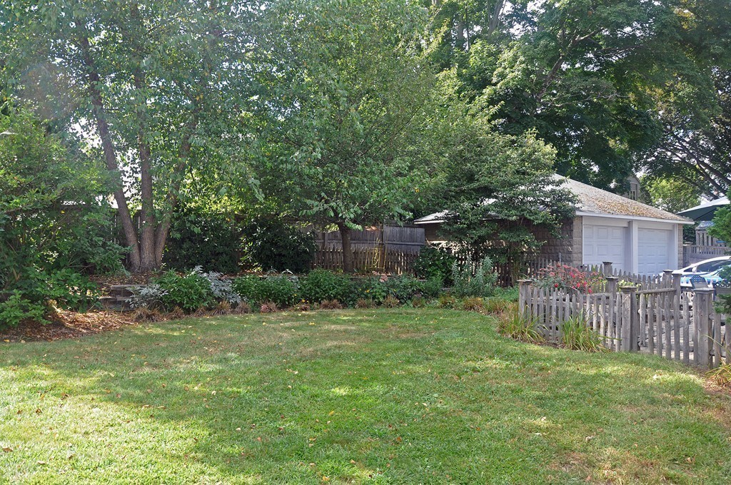 69 Reedsdale Road Milton, MA 02186 - Photo 12 of 13 a view of a house with a yard and deck