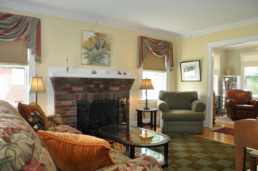 69 Reedsdale Road Milton, MA 02186 - Photo 4 of 13 a living room with furniture and a fireplace