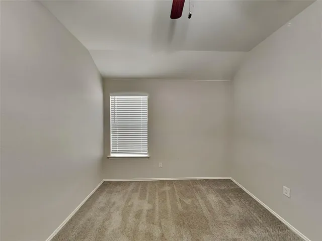 a view of a hallway with closet and wooden floor