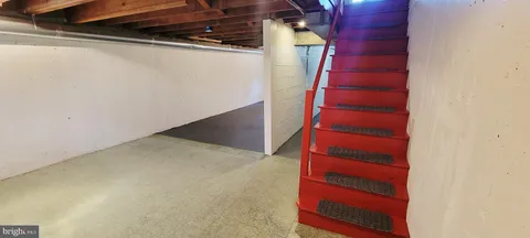 a kitchen with stainless steel appliances a sink and a refrigerator