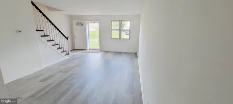 a view of entryway with wooden floor