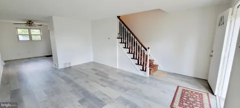 a bedroom with a bed and a mirror