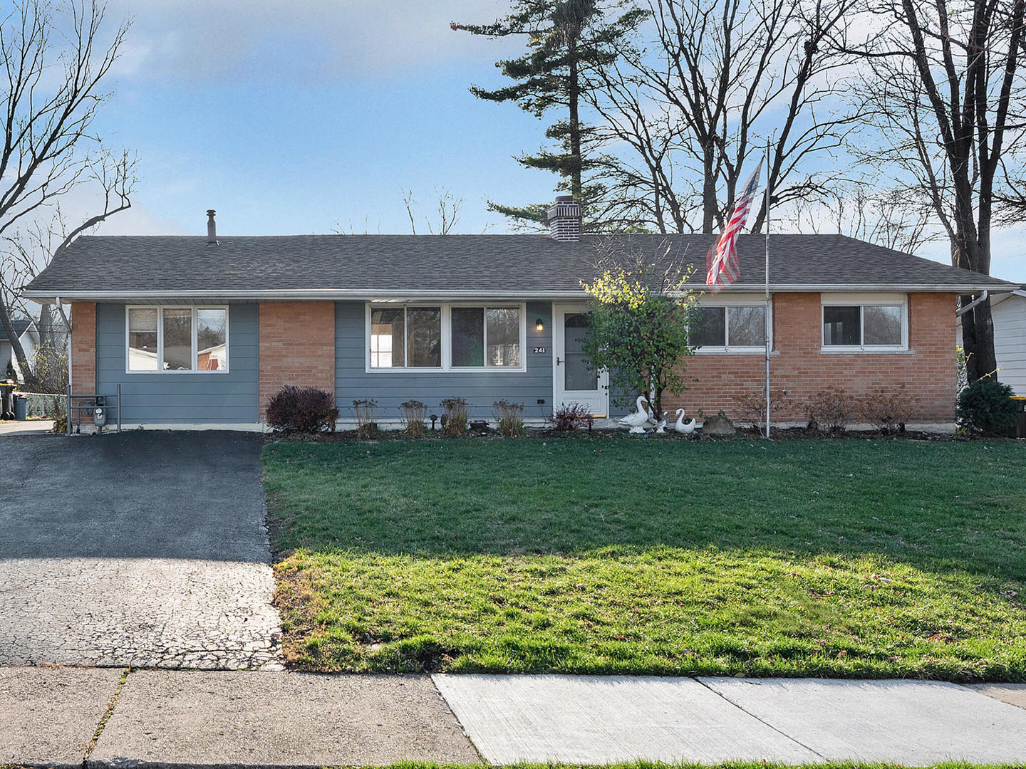 front view of a house with a yard