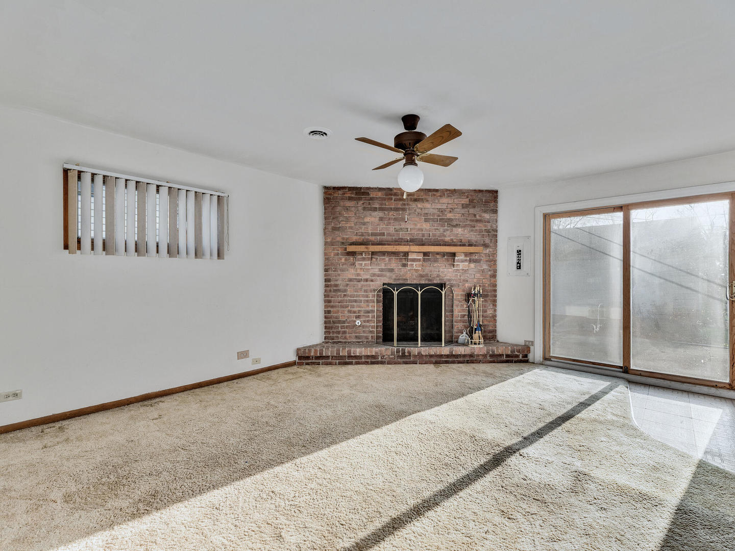 21W241 Coronet Road Lombard, IL 60148 - Photo 11 of 24 a view of an empty room with a fireplace and window