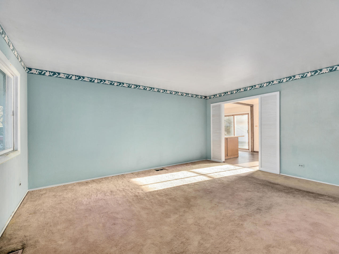 21W241 Coronet Road Lombard, IL 60148 - Photo 5 of 24 a view of an empty room with a window